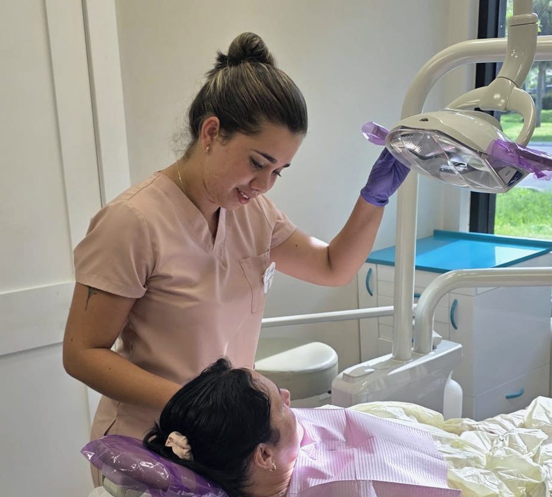 Dental assistant preparing a patient for treatment at our Bonita Springs office